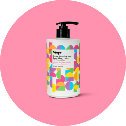 Unboxed SHOPE lemon lime and orange hand and body lotion, with pink circle background.